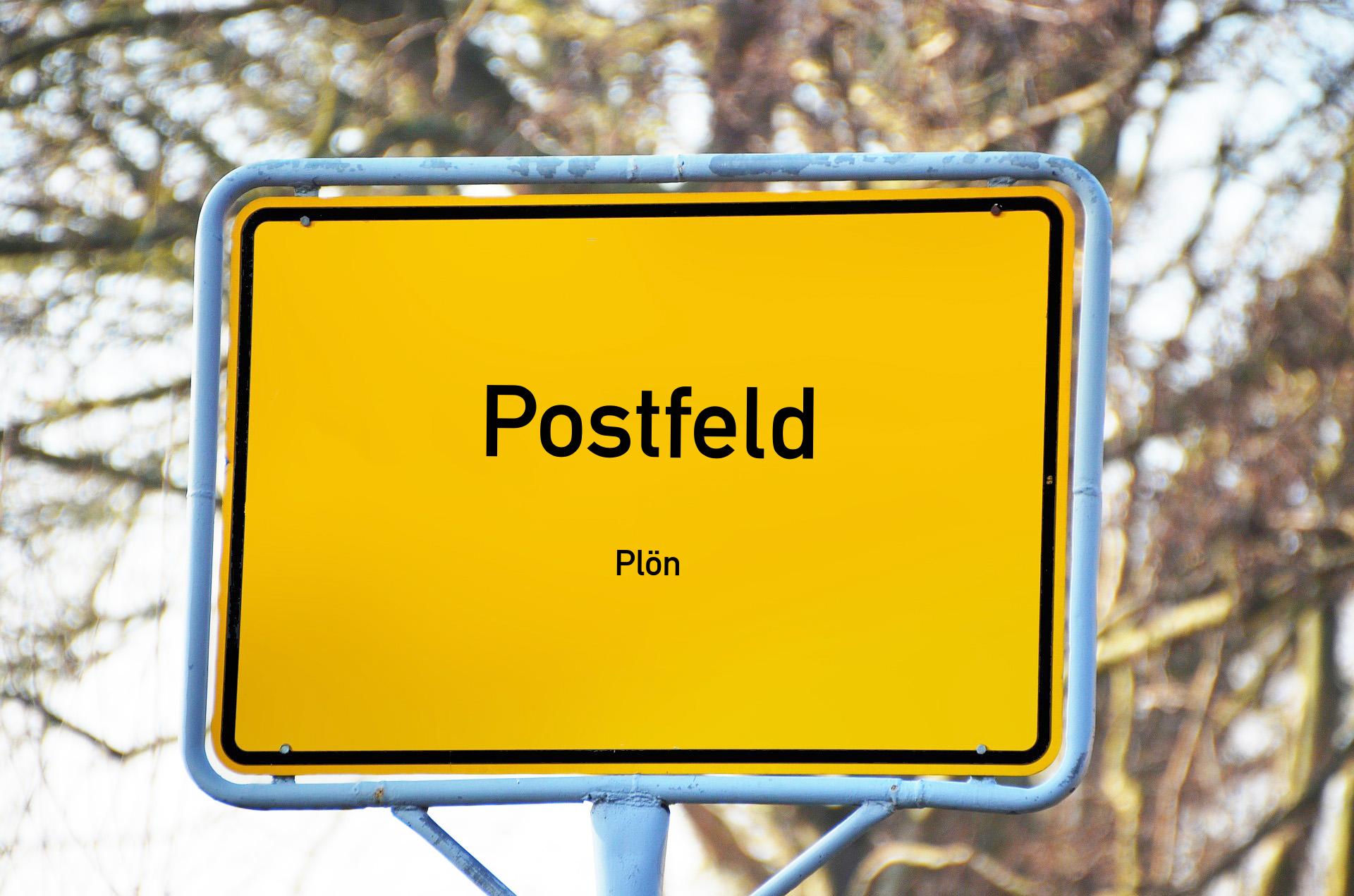 Ortsschild mit Aufschrift Postfeld