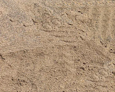 Nahaufnahme von beigem Rheinsand mit feiner Textur und gleichmäßiger Verteilung.